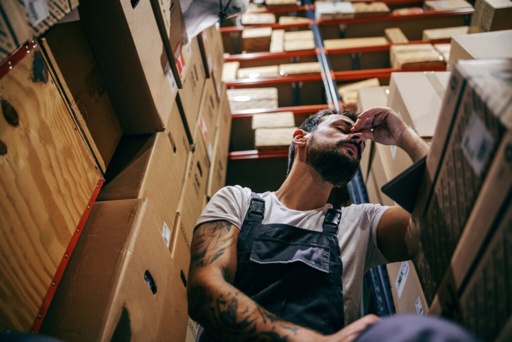 worker with headaches at work